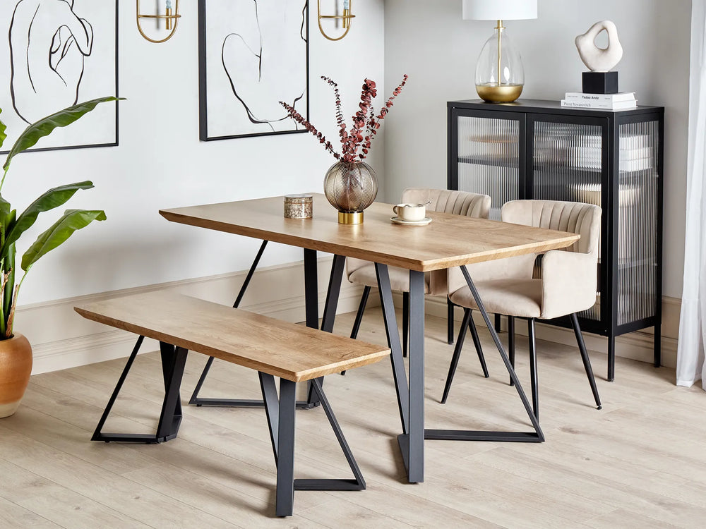 Dining room with wooden table, chairs, and bench in a modern interior setting.