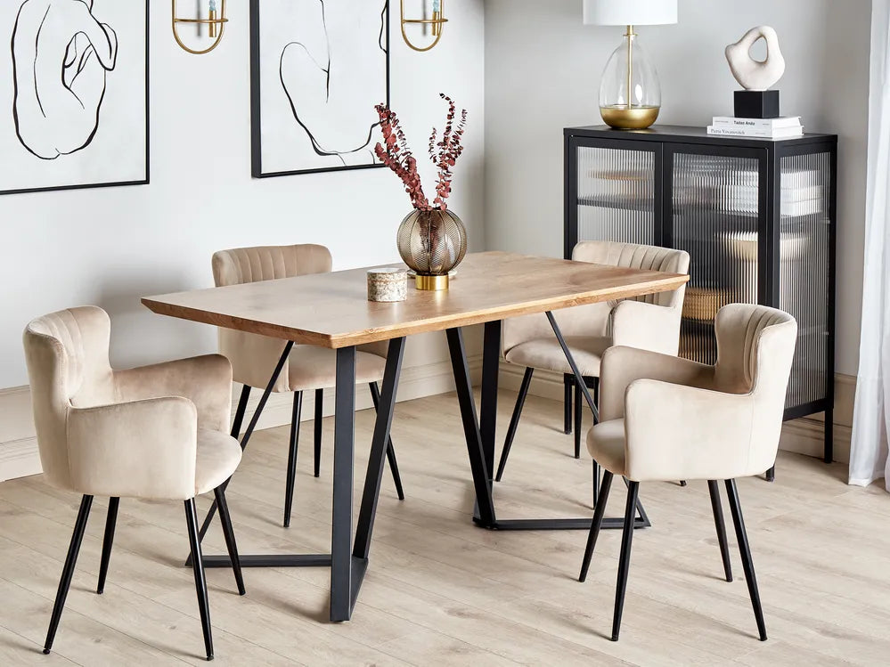 Dining room with a wooden table and beige chairs in a modern interior setting.