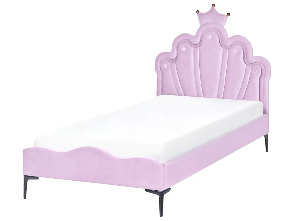 Pink bed with a crown design on the headboard against a white background