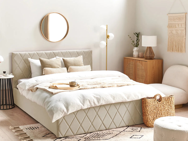 Neatly made bed in a bedroom with decorative elements.