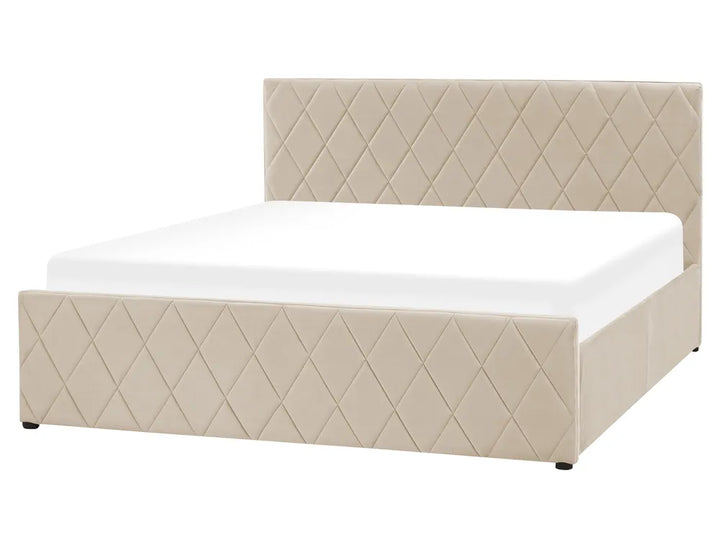 Beige quilted bed with white mattress on a white background
