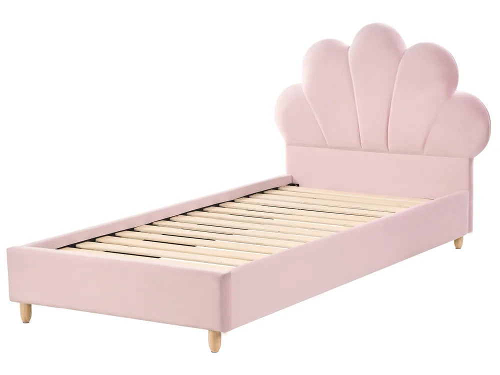 Pink shell-shaped bed on a white background