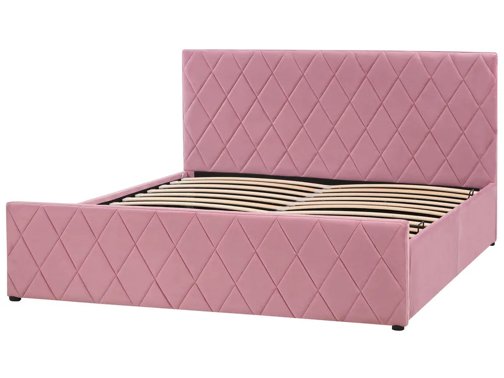 Pink quilted bed with diamond pattern on a white background