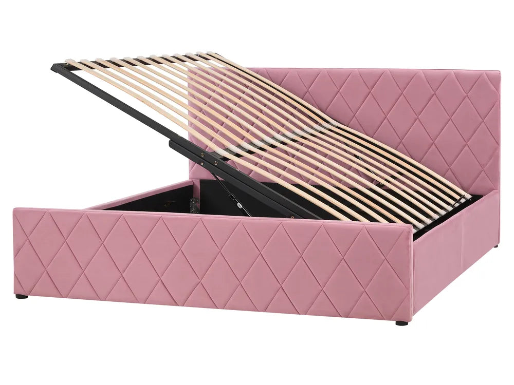 Pink quilted bed with open storage compartment on a white background