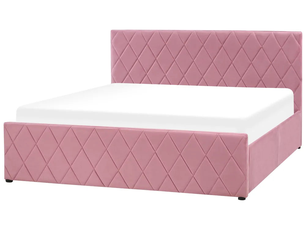 Pink quilted bed with white mattress on a white background
