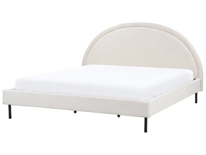White bed with curved headboard on a white background