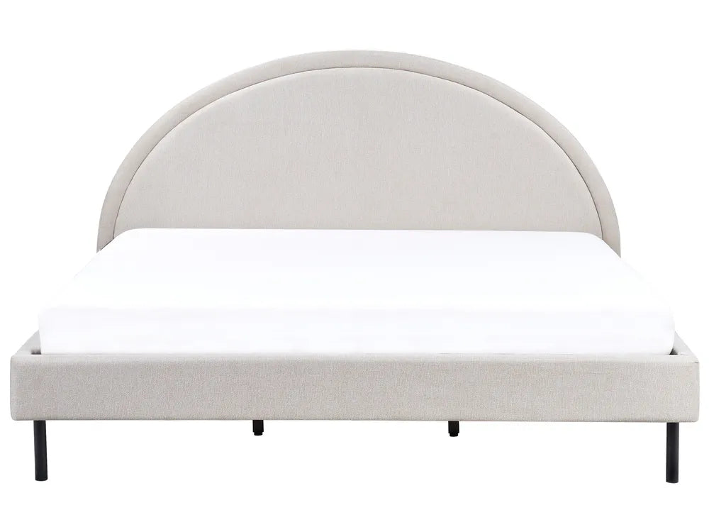 Beige upholstered bed frame with white mattress on a white background
