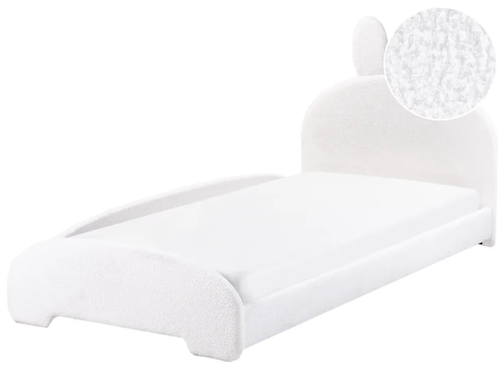 White bed with a close-up of the mattress on a white background