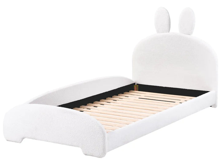 White children's bed with rabbit ears on a white background