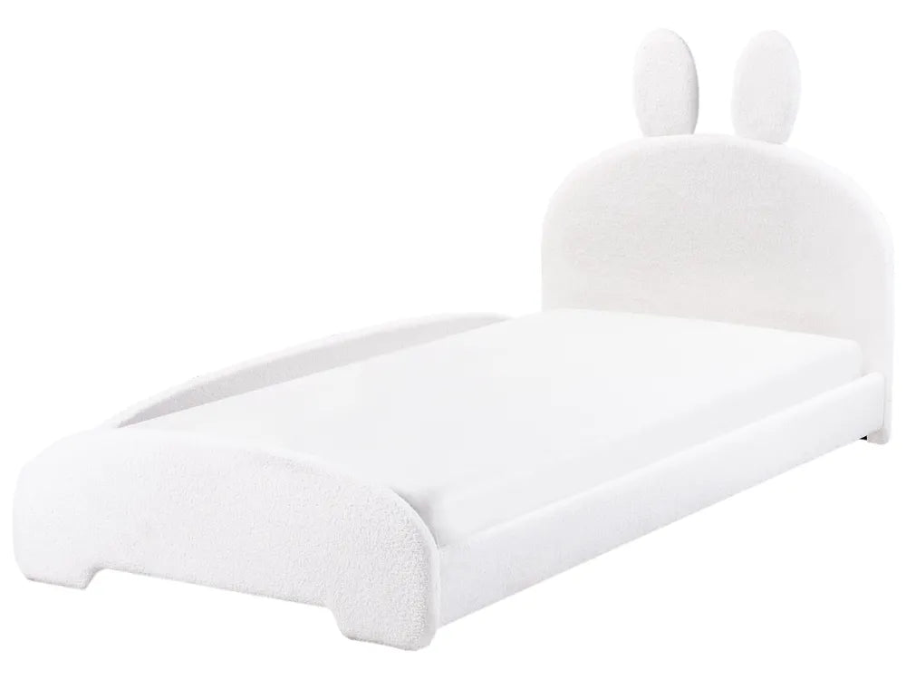 White bed with rabbit ears on a white background