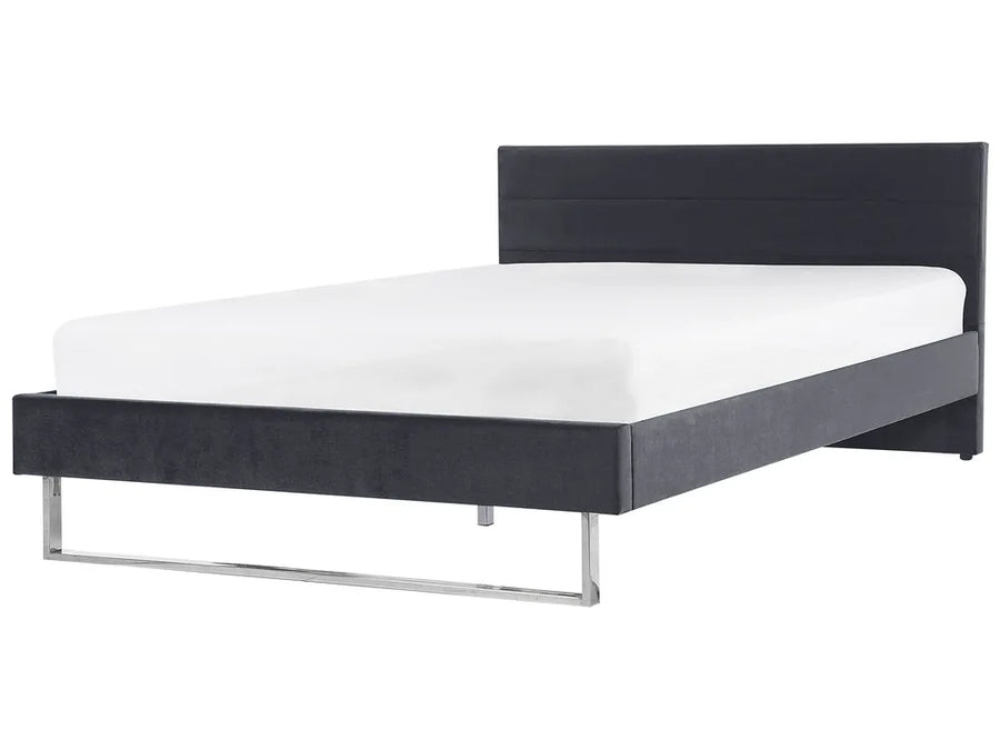 Black bed frame with white mattress on a white background