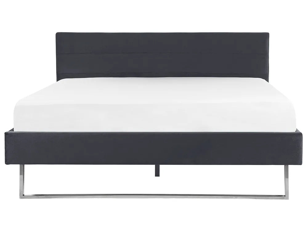 Black bed frame with white mattress on a white background