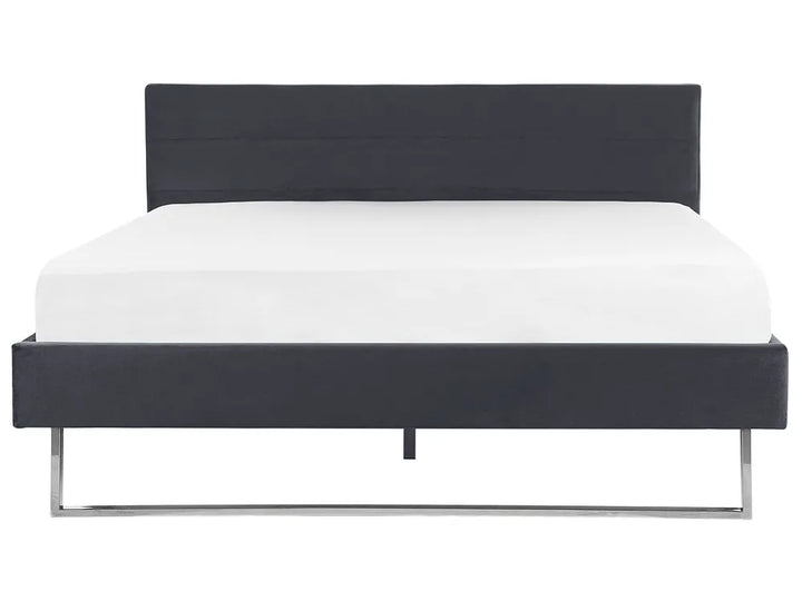 Black bed frame with white mattress on a white background