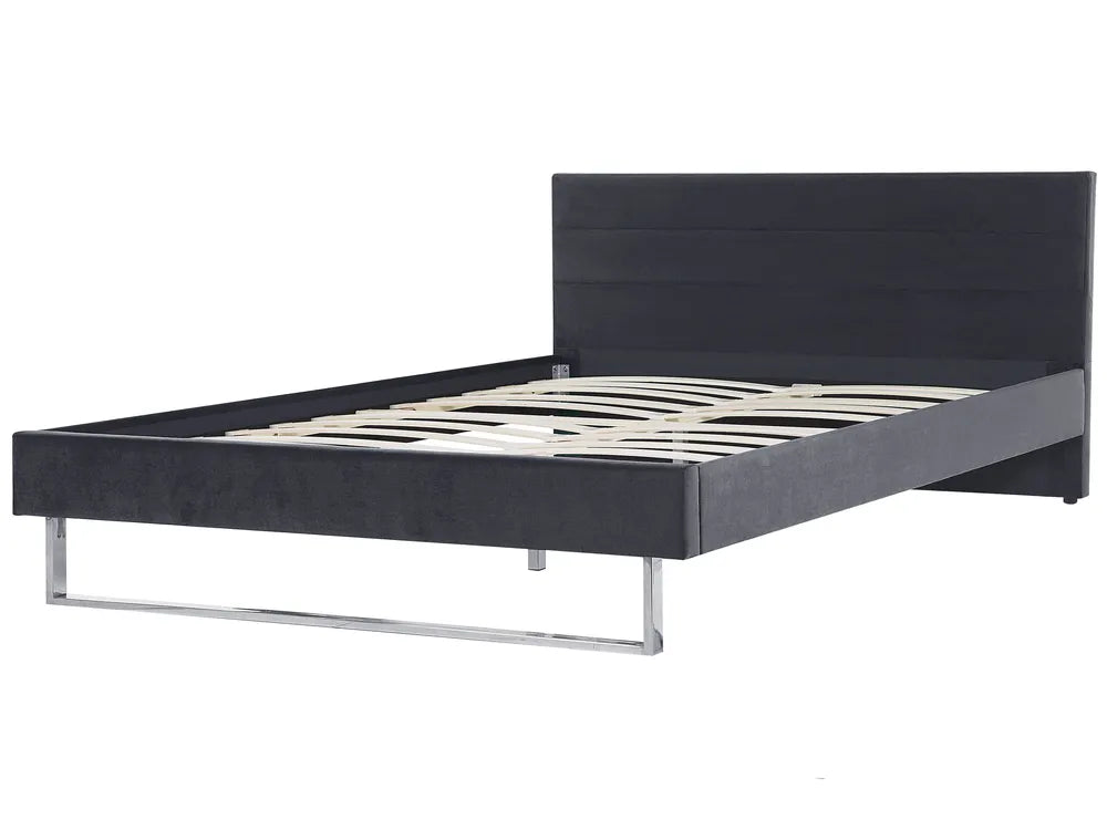 Wooden bed frame with a chevron pattern on the headboard against a white background