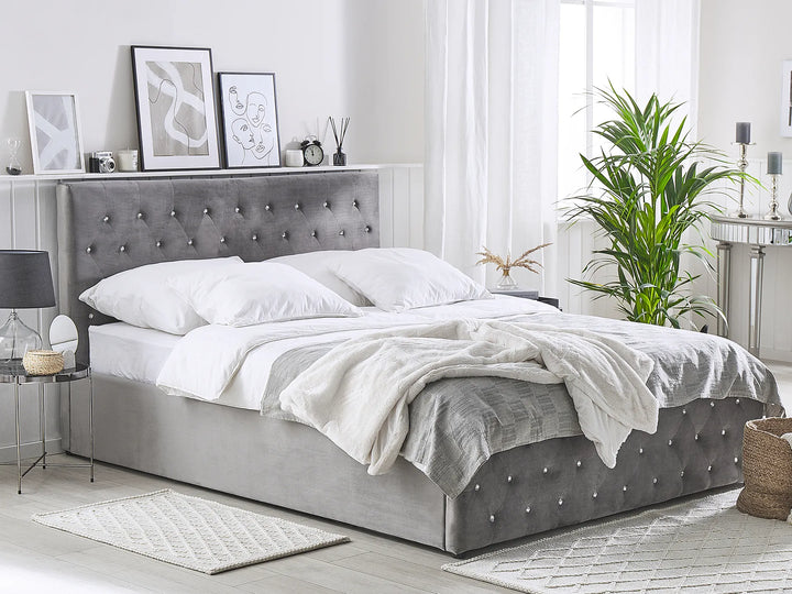 Upholstered velvet bed with metal frame and tufted headboard