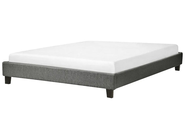Gray bed frame with white mattress on a white background