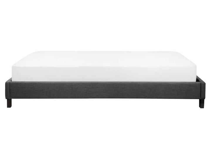 Black bed frame with white mattress on a white background