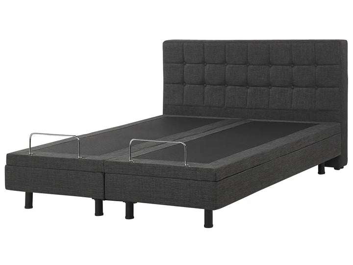 Dark gray adjustable bed with headboard on a white background