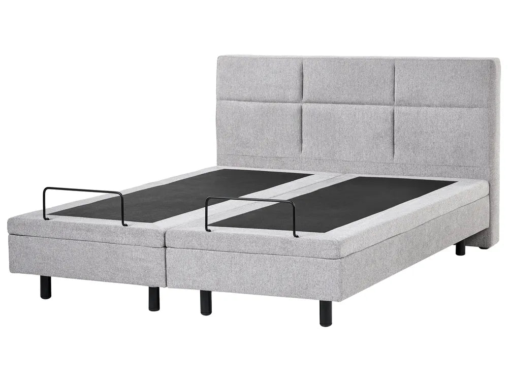 Gray upholstered bed with adjustable base on a white background