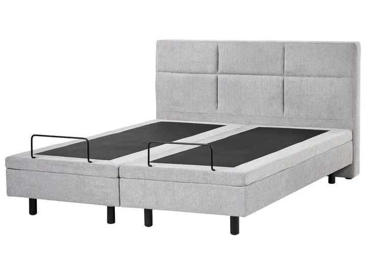 Gray upholstered bed with adjustable base on a white background