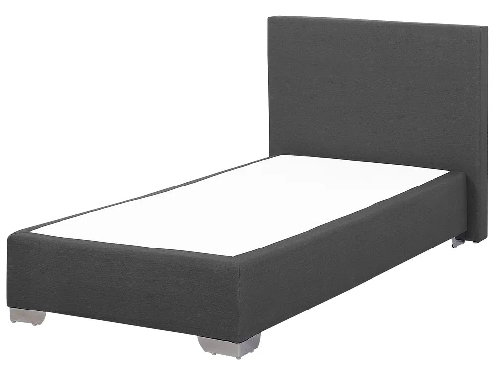 Dark gray upholstered bed with white mattress on a white background
