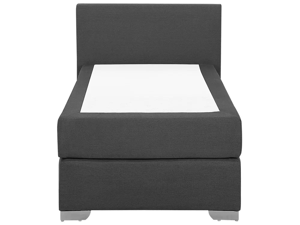 Gray upholstered bed with white mattress on a white background