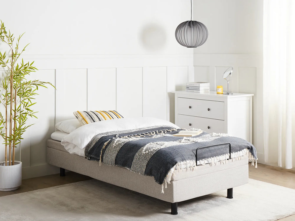 Bedroom with a bed, nightstands, and a plant