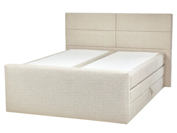 Beige upholstered bed with a headboard on a white background
