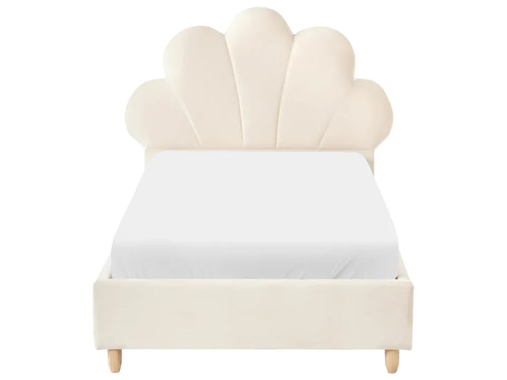 Beige shell-shaped headboard bed with white mattress on a white background