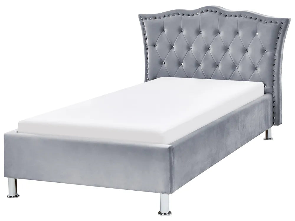Gray upholstered bed with tufted headboard on a white background