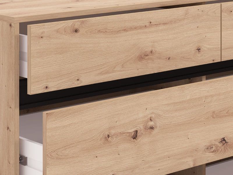 Wooden drawer with black trim on a piece of furniture