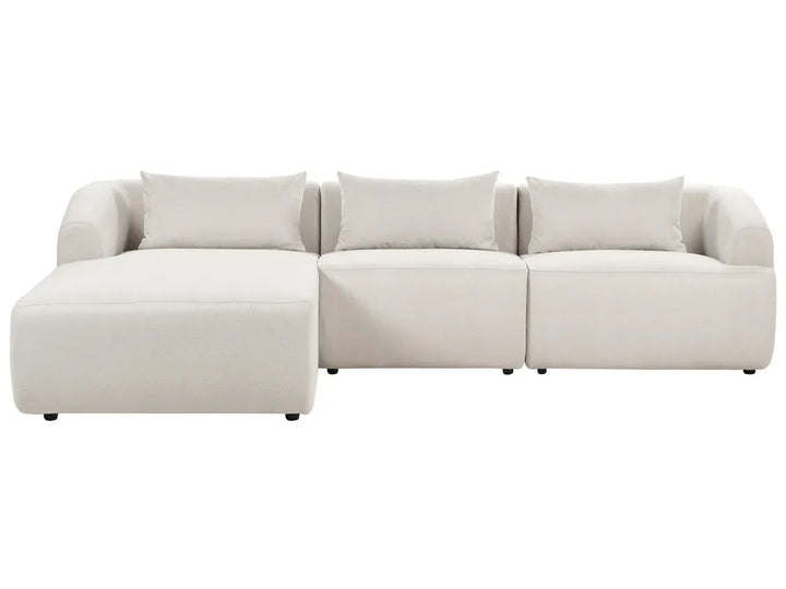 Beige sectional sofa on a white background