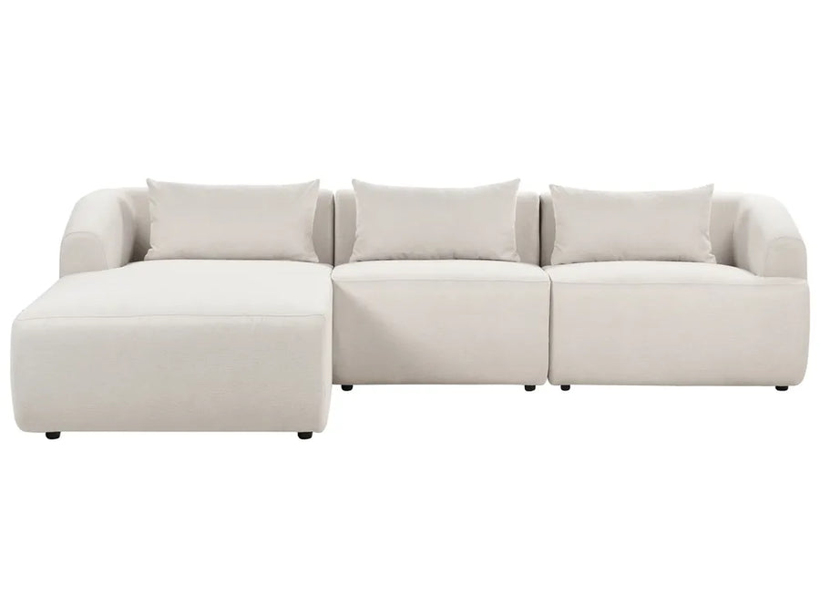 Beige sectional sofa on a white background