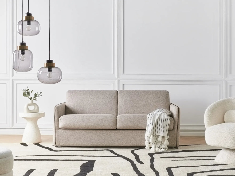 Modern light brown fabric sofa bed with cushioned seat and backrest