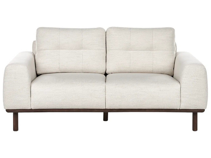 Beige sofa with wooden legs on a white background