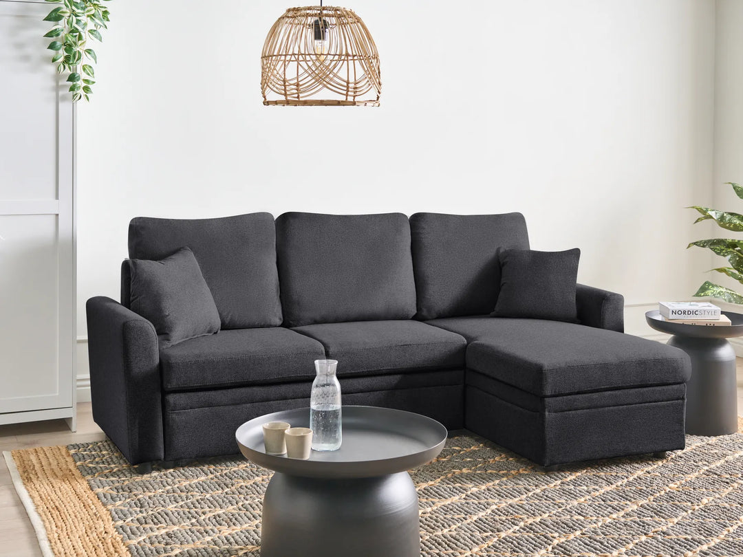 Left hand black fabric corner sofa bed with storage