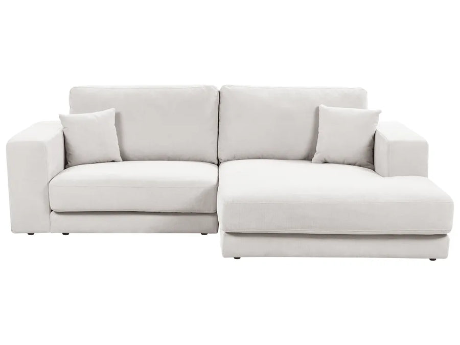 Light gray sectional sofa on a white background