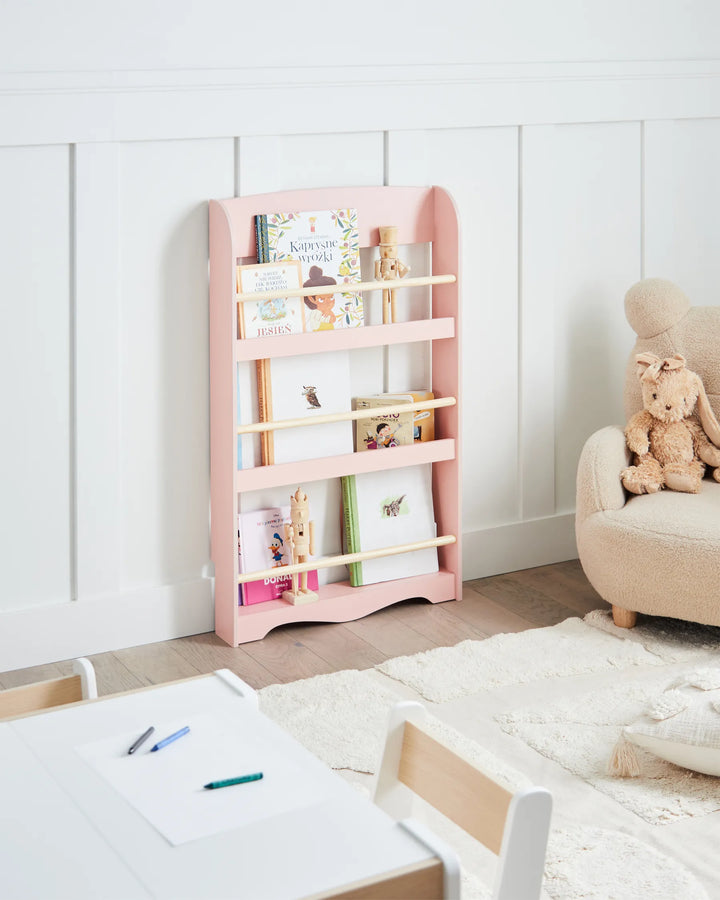 Children's room with a pink bookshelf, toys, and a chair.
