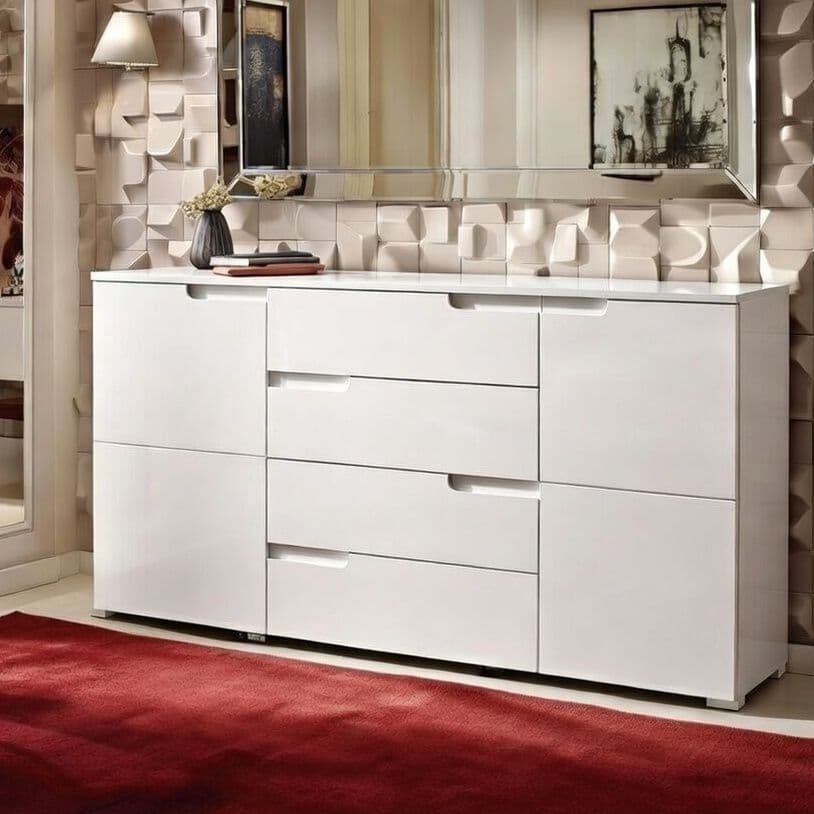 White dresser with multiple drawers in a room with geometric wall design
