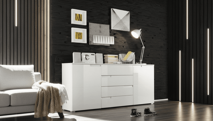 Modern living room with a white sideboard, sofa, and decorative elements.