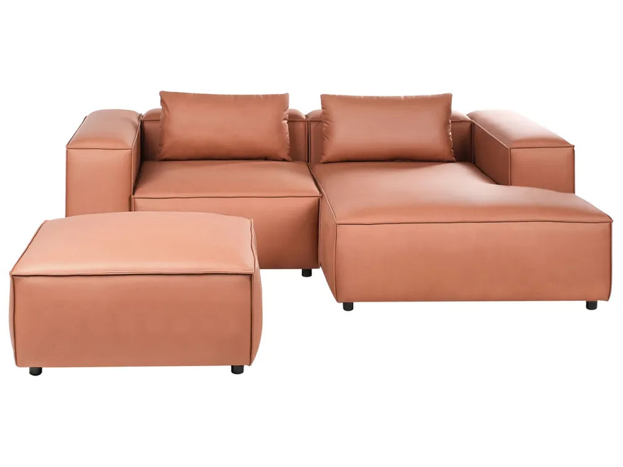 Brown leather sectional sofa with ottoman on a white background