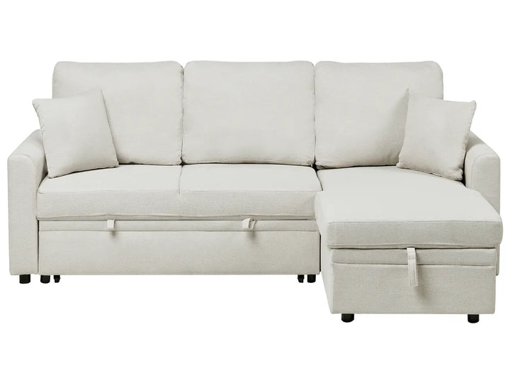 Beige sectional sofa with storage on a white background
