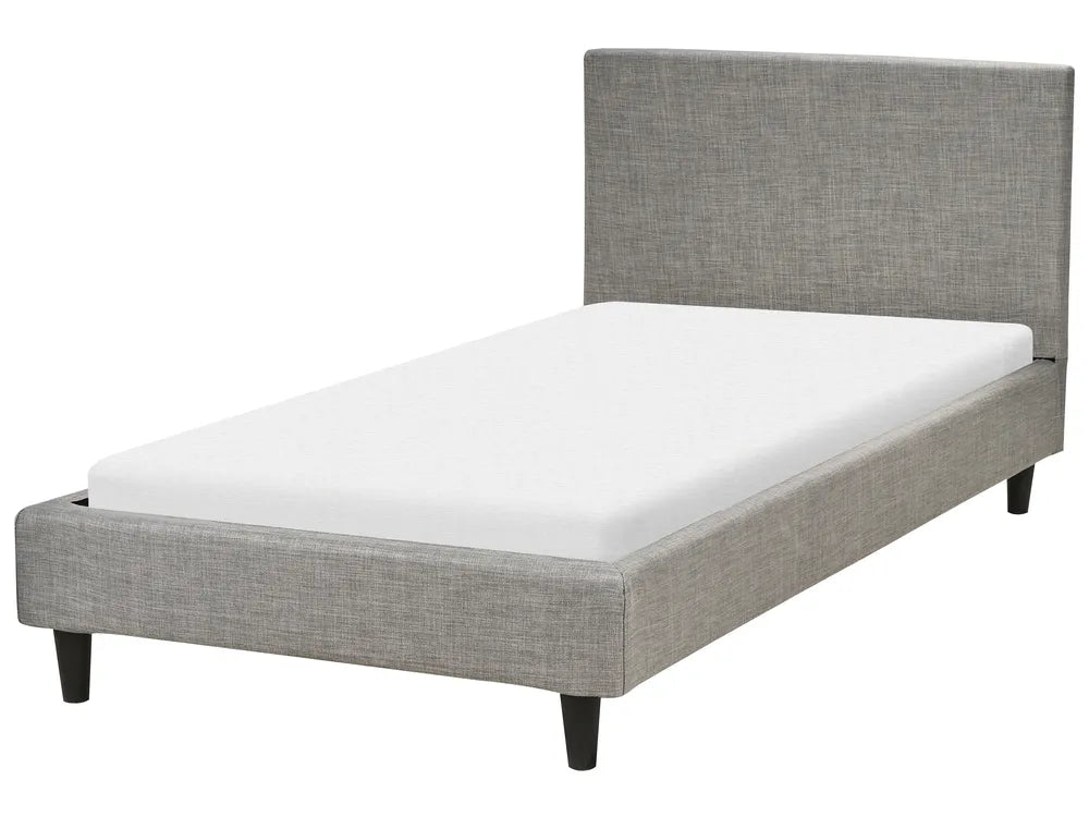 Gray upholstered bed with white mattress on a white background