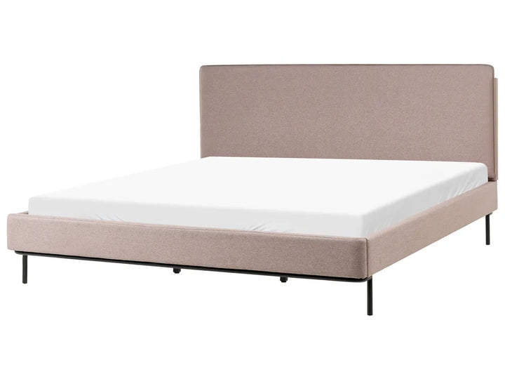 Beige upholstered bed frame with white mattress on a white background