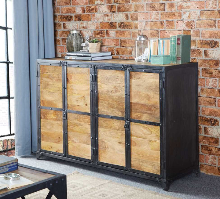 Wooden cabinet with metal accents against a brick wall