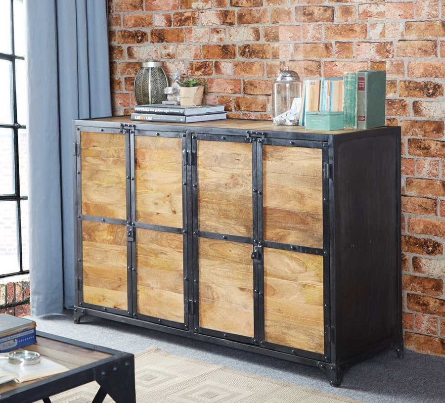 Wooden cabinet with metal accents against a brick wall