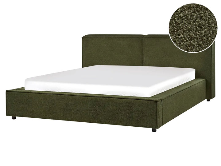 Green upholstered bed with white mattress on a white background