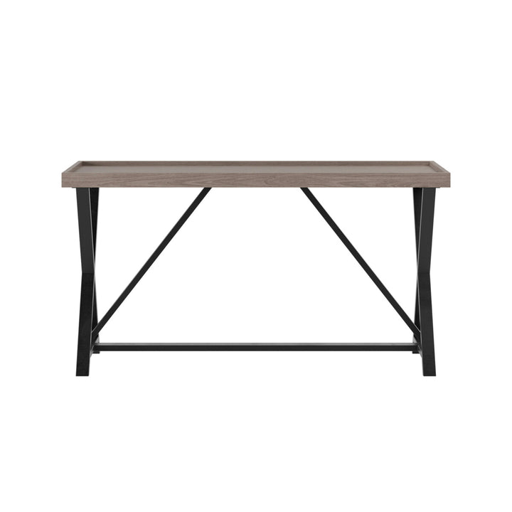 Wooden table with black metal legs on a white background