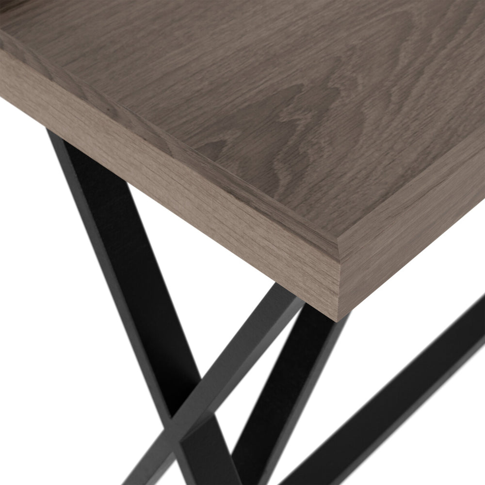 Wooden table with black metal legs on a white background