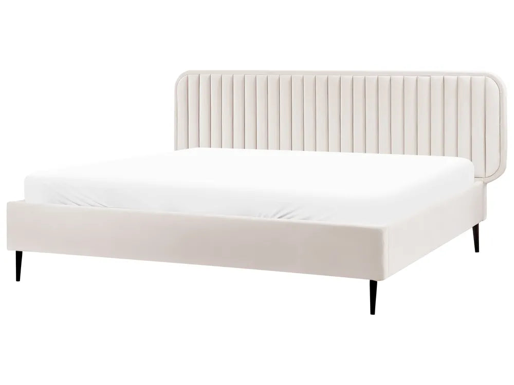 White bed with a ribbed headboard on a white background